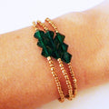 Armbänder aus smaragdgoldenen Perlen