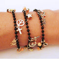 Gold skull crucifix star peace black beads bracelet