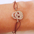 Goldenes Totenkopf-Strassarmband in Braun